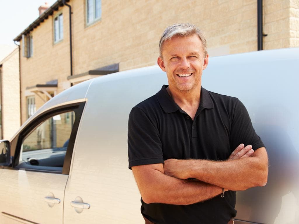 Man in front of minivan L