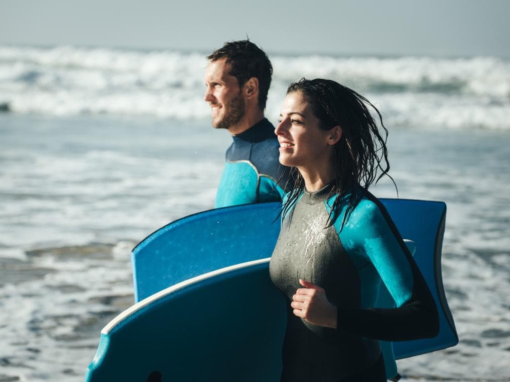 a couple surfing